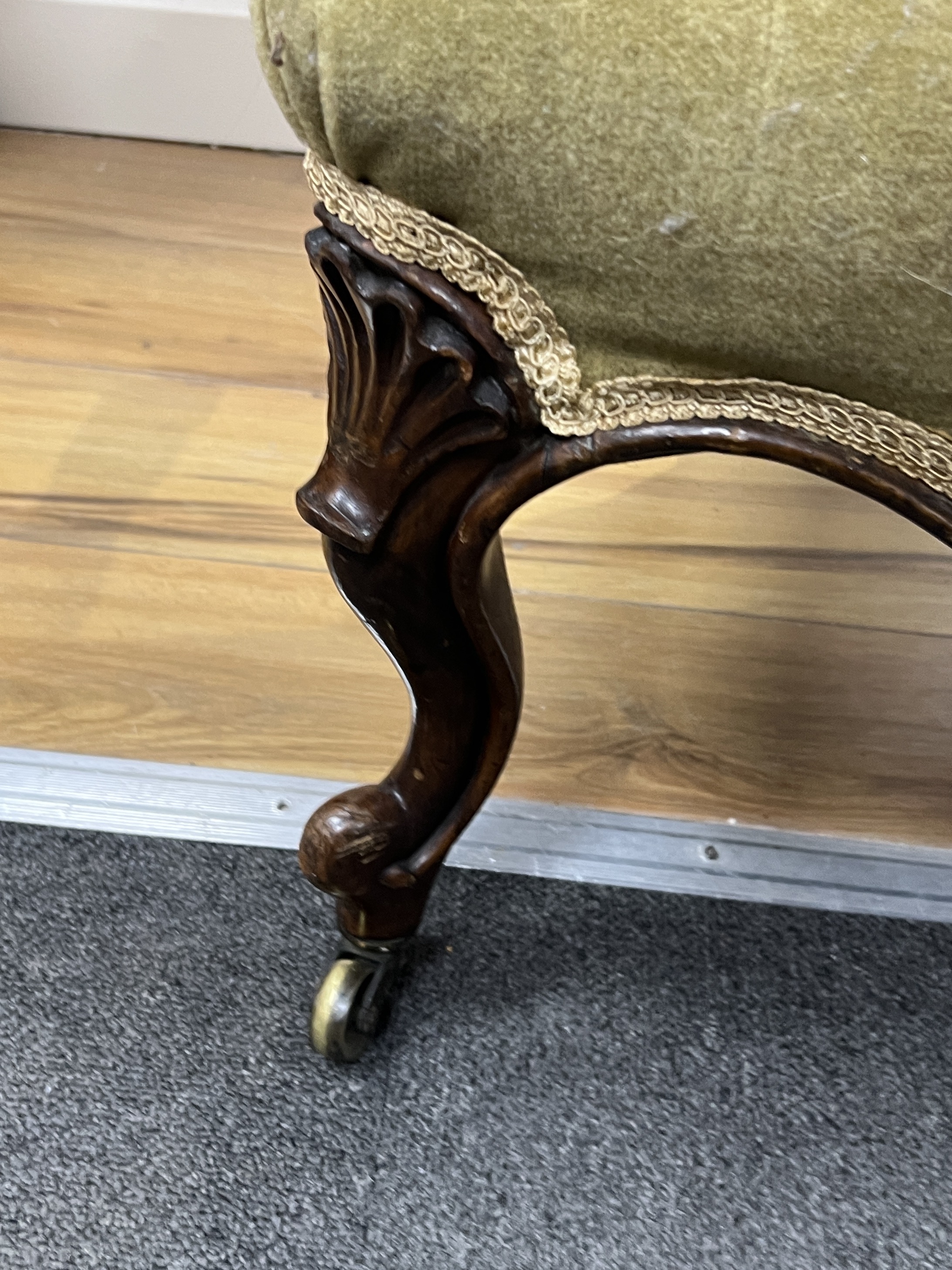 A Victorian carved walnut spoon back armchair, width 52cm, depth 66cm, height 91cm